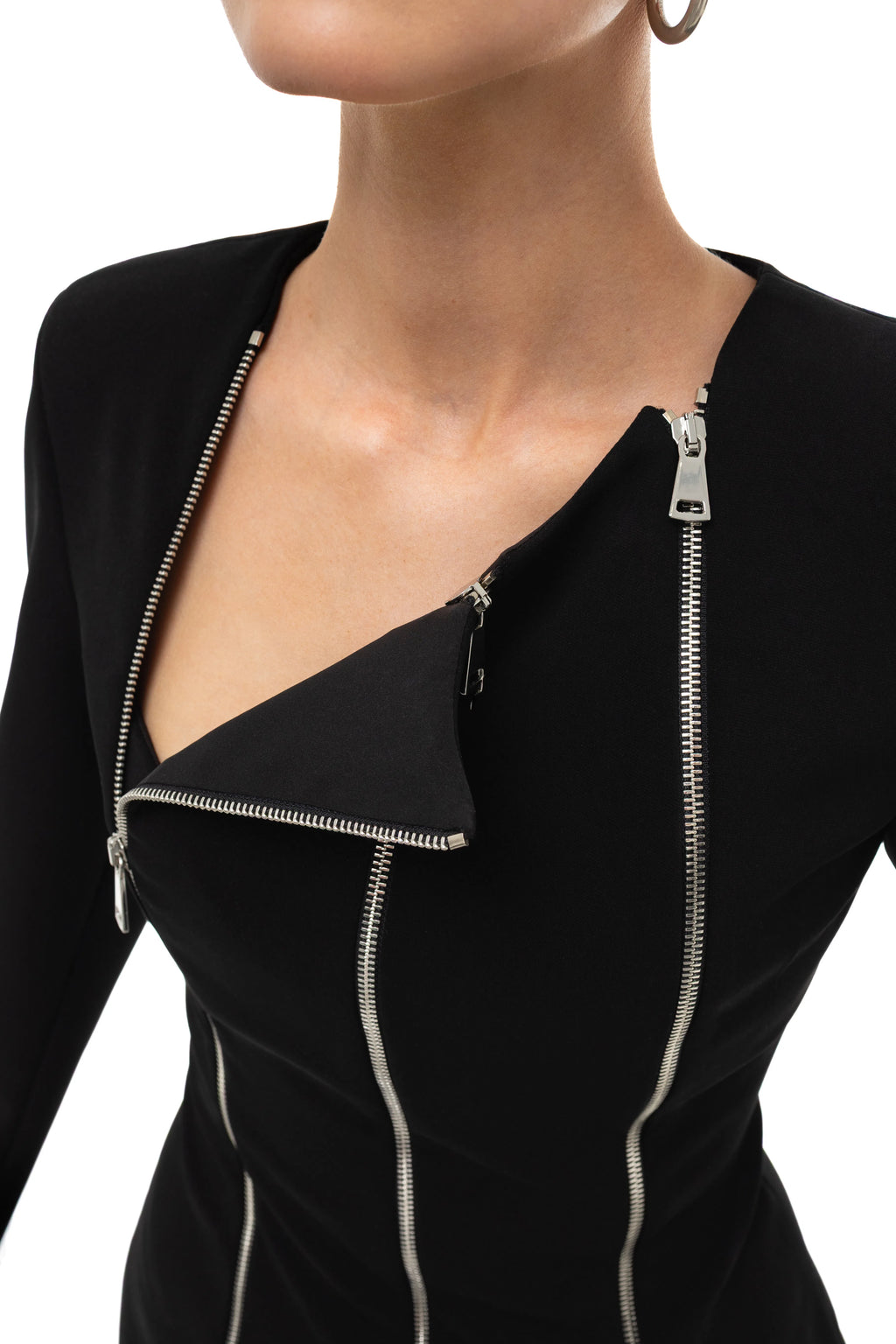 Black dress with silver zipper detail by Soluje on a white background. 
