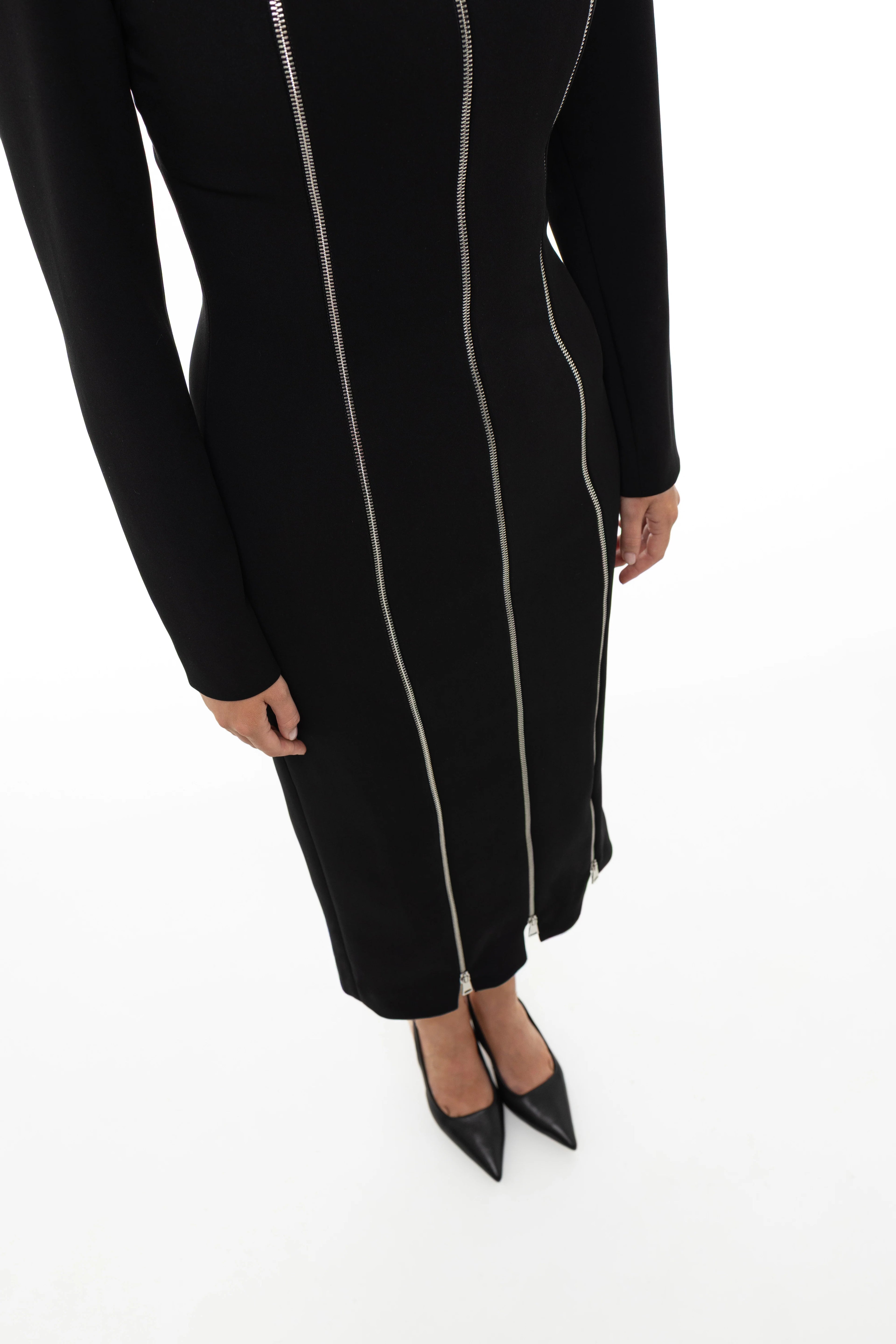 Black dress with silver zipper details on a white background by Soluje