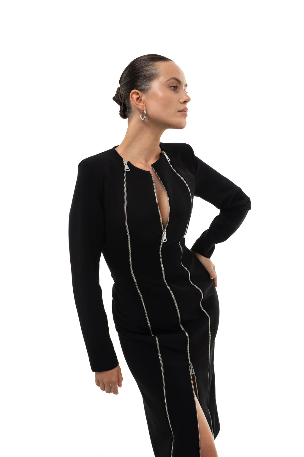 Woman wearing a black outfit with three silver zippers details styled for party settings by soluje on a white background. 